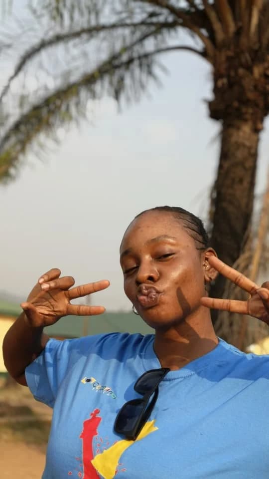 Peace making peace signs in a CHECKMATE T-shirt