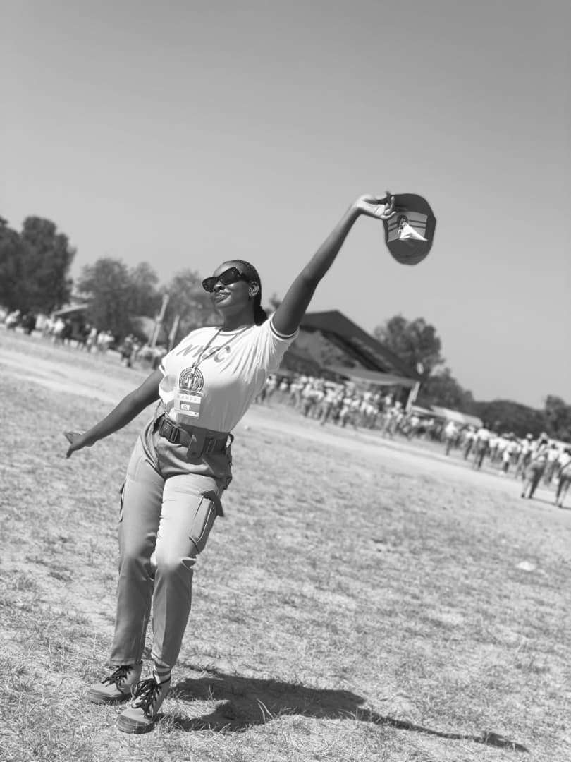 Peace waving her cap at NYSC camp